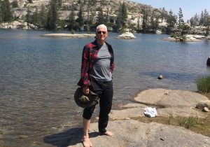 Richard de Neufville standing at the water's edge at Paradise Lake